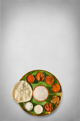 south india meals, meals served on banana leaf brass plate , traditional south indian cuisine, rice, sambar, rasma, appalam, white rice, curd, buttermilk