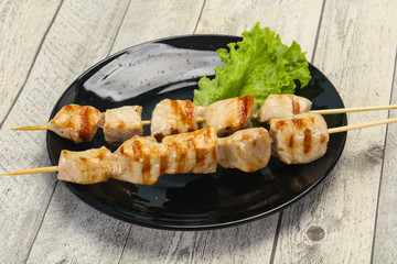 Grilled pork skewer served salad