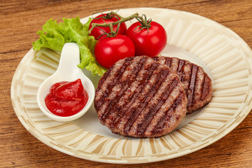 Grilled burger cutlet with sauce