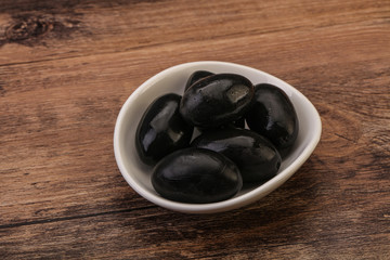 Pickled black olives in the bowl