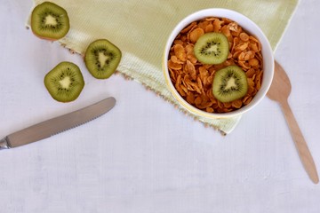 Fresh kiwi fruit whit cereal served in a bowl/ Conceptual image of healthy breakfast 