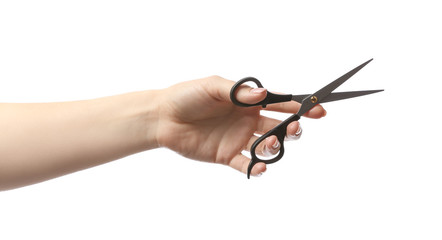 Female hand with hairdresser's scissors on white background