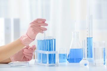 Scientist working with sample in laboratory