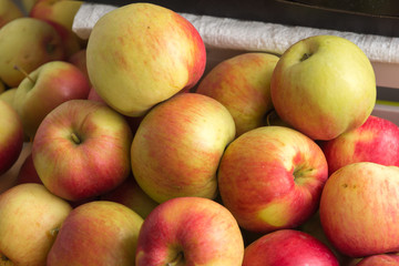 Ripe red apples in a wicker basket