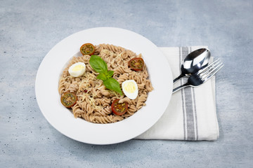 Vegetarian Vegetable pasta Fusilli in white bowl.