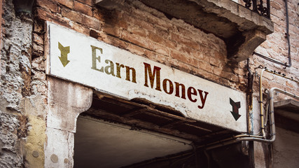 Obraz premium Street Sign Earn Money