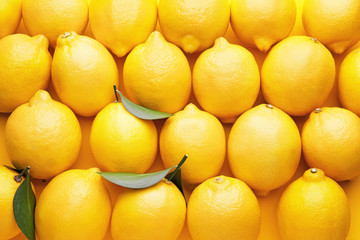 Fresh ripe lemons as background