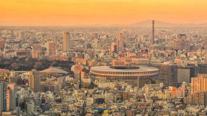 Top view of Tokyo city skyline at sunset .