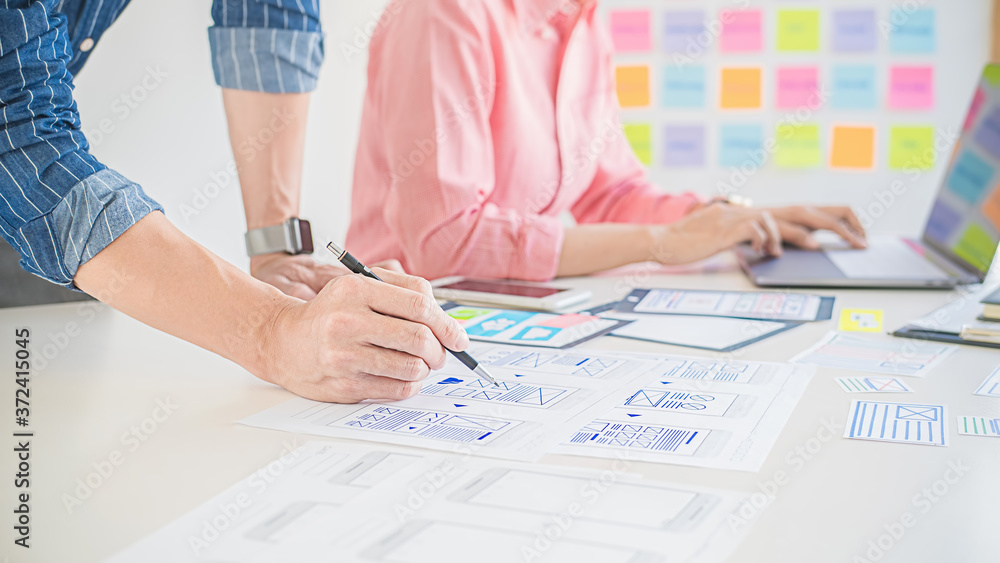 Wall mural creative web designer planning application and developing template layout, framework for mobile phon