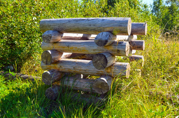 wall of a house made of wooden beams in a Russian village, abstract background