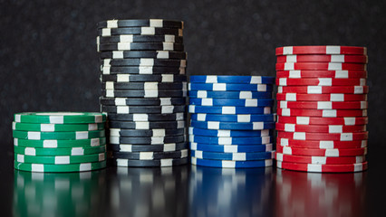 multicolored game poker chips on the table