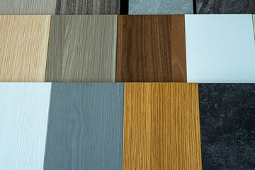 Samples of interior furniture material. Wooden pieces on shelf. Close up