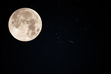 Fototapeta na wymiar Full moon on the sky with real stars.