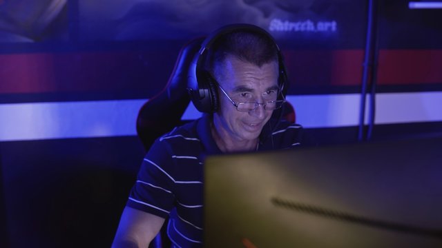 Old Man Gamer Is Emotionally Playing And Winning In A Computer Game