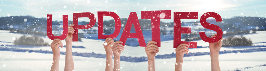 People Hands Holding Word Updates, Snowy Winter Background