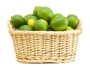 lime lemons group in basket on white background