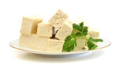 Tofu cubes on white plate isolated on white