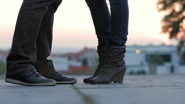 Man and woman legs on street