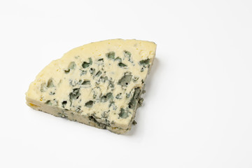 Triangular piece of blue cheese. Isolated on a white background.