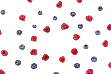 raspberries and blueberries isolated on white background