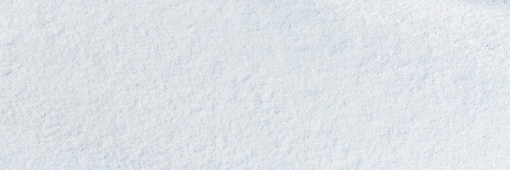 Natural snow texture. Smooth surface of clean fresh snow. Snowy ground. Winter background with snow...