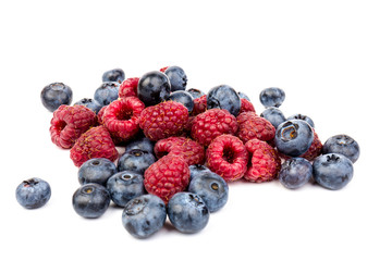 raspberries and blueberries isolated on white background