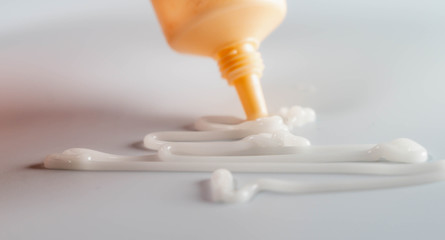 Cosmetic white liquid cream. Hyaluronic acid cosmetic gel. Skin care product on white background....