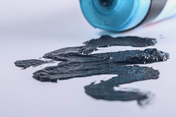Black charcoal face mask or scrub isolated on a white background. Face care concept.