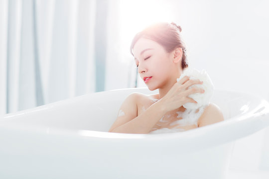  young woman take a bath in bathtub