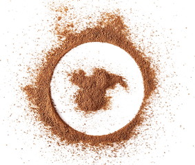 Cinnamon powder pile, round frame and border isolated on white background, top view