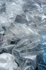 Rolled plastic bottles for recycling.