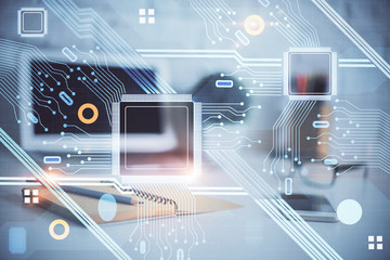 Double exposure of desktop computer and technology theme hologram. Concept of software development.
