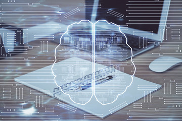 Multi exposure of work table with computer and brain hologram. Brainstorm concept.