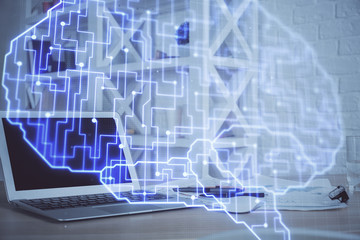 Multi exposure of work table with computer and brain hologram. Brainstorm concept.