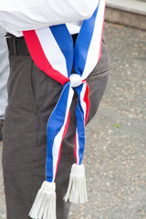 French mayor detail with scarf flag tricolor during celebration in France