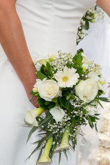 Bride woman holding in hand wedding bouquet flowers