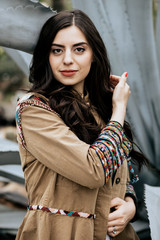 Portrait of beautiful woman wearing beige fashion jacket outdoor