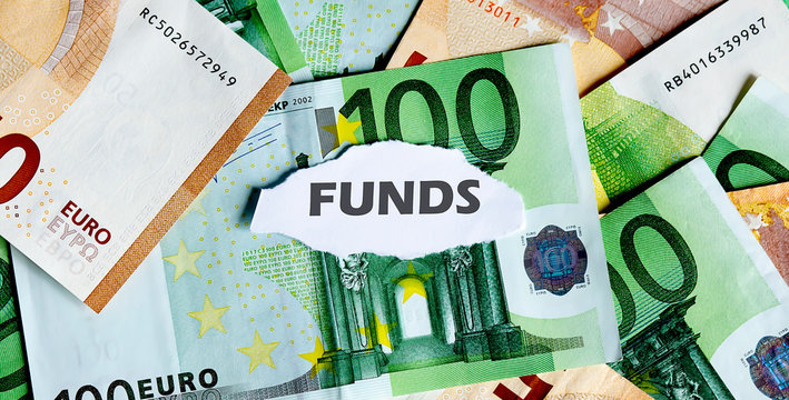 Focus on the word FUNDS , on piece of torn white paper with EUROS currency as a background.