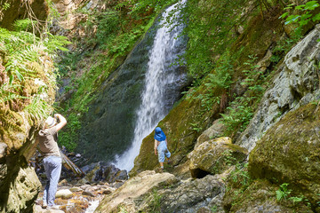 Hiking with the family on the trail "H&ouml;llsteig" in the canyon "Ravennaschlucht" in the Black Forest in Germany