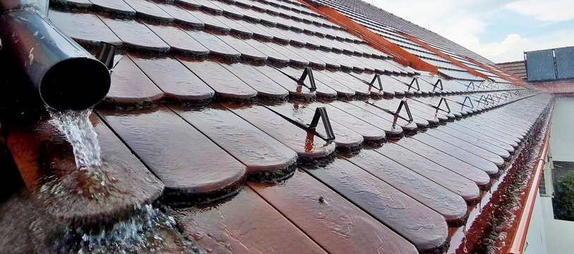Closeup of roof tiles during heavy rain
