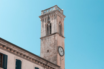 Fototapeta na wymiar Clock tower in the central square of Pietrasanta, Italy
