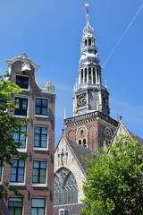 Close-up on Oude kerk church, located along Oudezijds Voorburgwal canal in Amsterdam, Netherlands,...