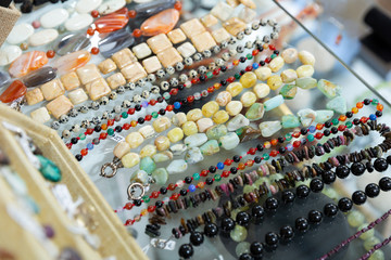 Obraz premium Close up of natural stone bead necklaces in jewelry shop