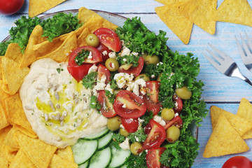 Hummus with vegetables salad and nachos