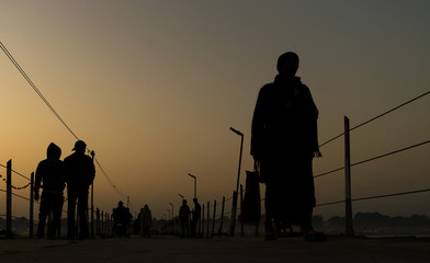 silhouette of a people on a bridge