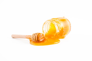 honey and honey in jar on white background