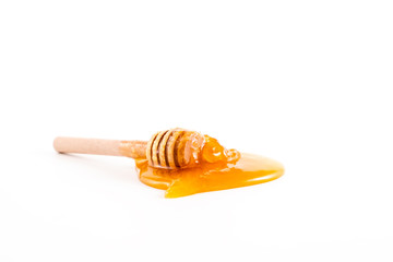 honey and honey in jar on white background