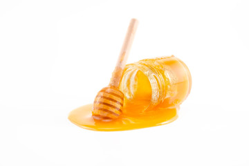 honey and honey in jar on white background