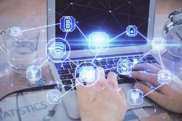 Social network theme hologram with businessman working on computer on background. Concept of world wide web. Double exposure.