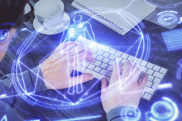 Science hologram with man working on computer on background. Concept of study. Double exposure.